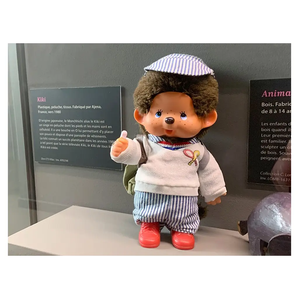 French-market Kiki (Monchhichi) doll made by Ajena in the 1980s, in a museum display.