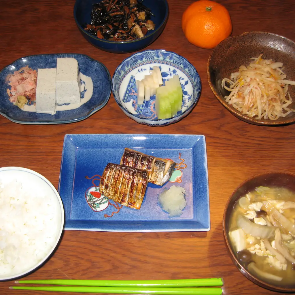A Japanese home dinner of soup and several small dishes.