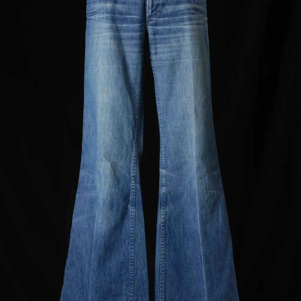 A pair of blue bell-bottom jeans from the 1970s.