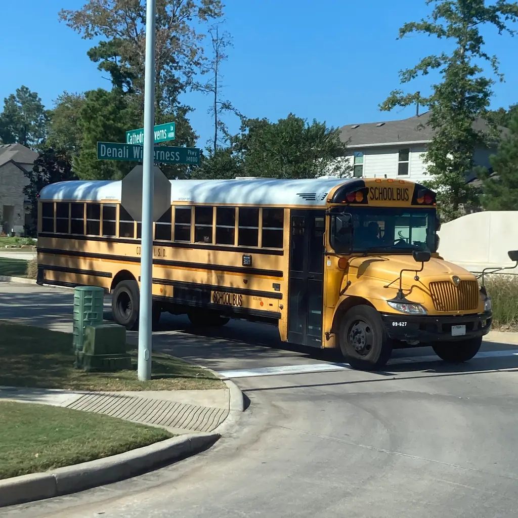 A yellow American school bus parked on a street.